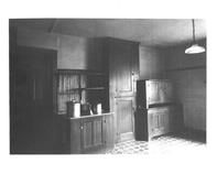 SA1324.7a - Four different interiors, showing cupboards, a kitchen with two women, a bench along a wall, and a cabinet with small drawers., Winterthur Shaker Photograph and Post Card Collection 1851 to 1921c